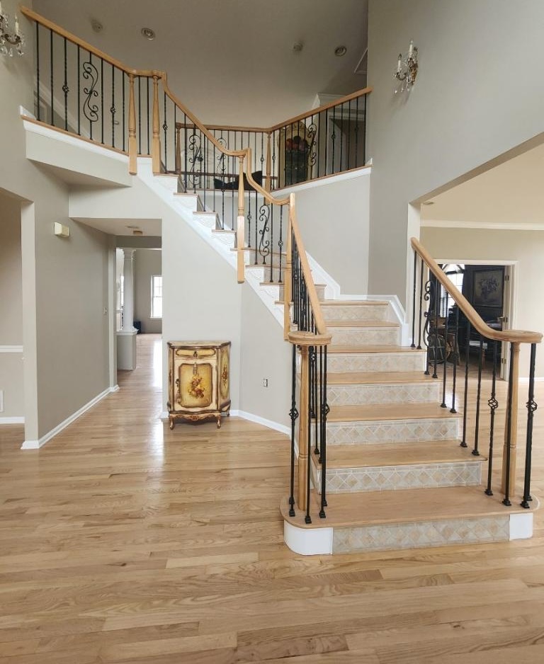 Refinished red oak hardwood foyer and staircase by AXO Floors NJ